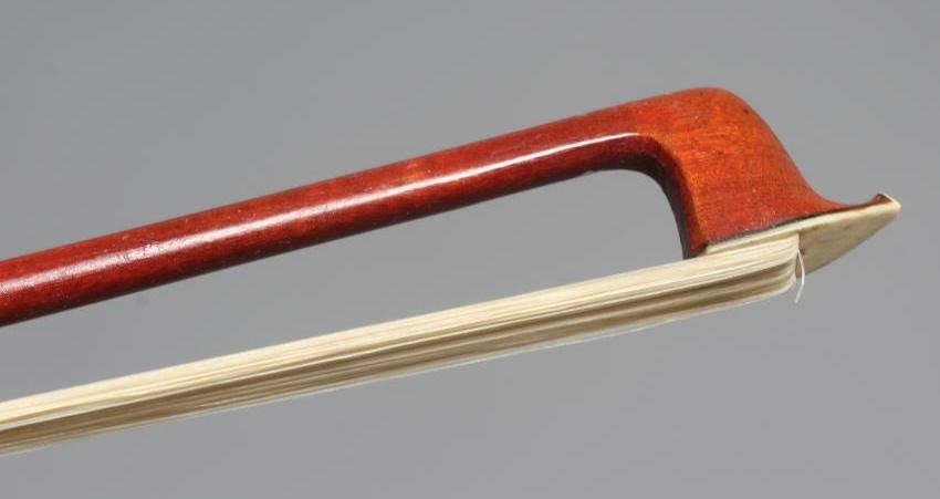 A VIOLIN BOW BY V J FERELLI with nickel mounted mother-of-pearl inlaid ebony frog Image