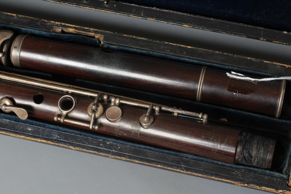 A THREE PIECE COCUSWOOD CONICAL FLUTE BY RUDALL & ROSE Image