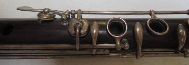 A THREE PIECE COCUSWOOD CONICAL FLUTE BY RUDALL & ROSE Image