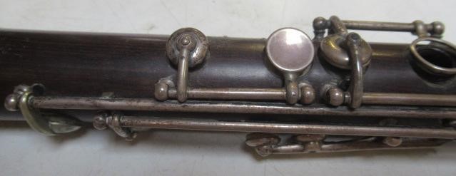 A THREE PIECE COCUSWOOD CONICAL FLUTE BY RUDALL & ROSE Image
