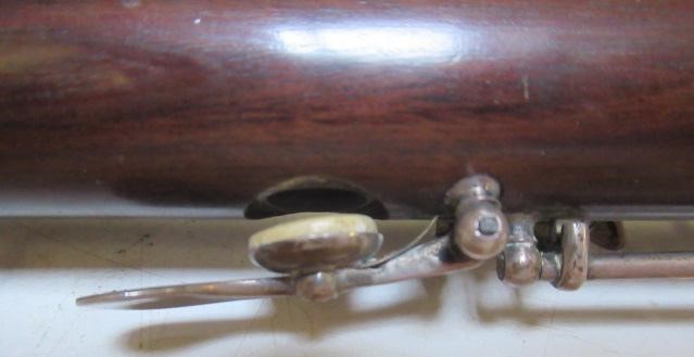 A THREE PIECE COCUSWOOD CONICAL FLUTE BY RUDALL & ROSE Image