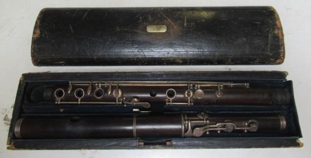 A THREE PIECE COCUSWOOD CONICAL FLUTE BY RUDALL & ROSE Image