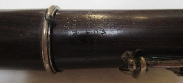 A THREE PIECE COCUSWOOD CONICAL FLUTE BY RUDALL & ROSE Image