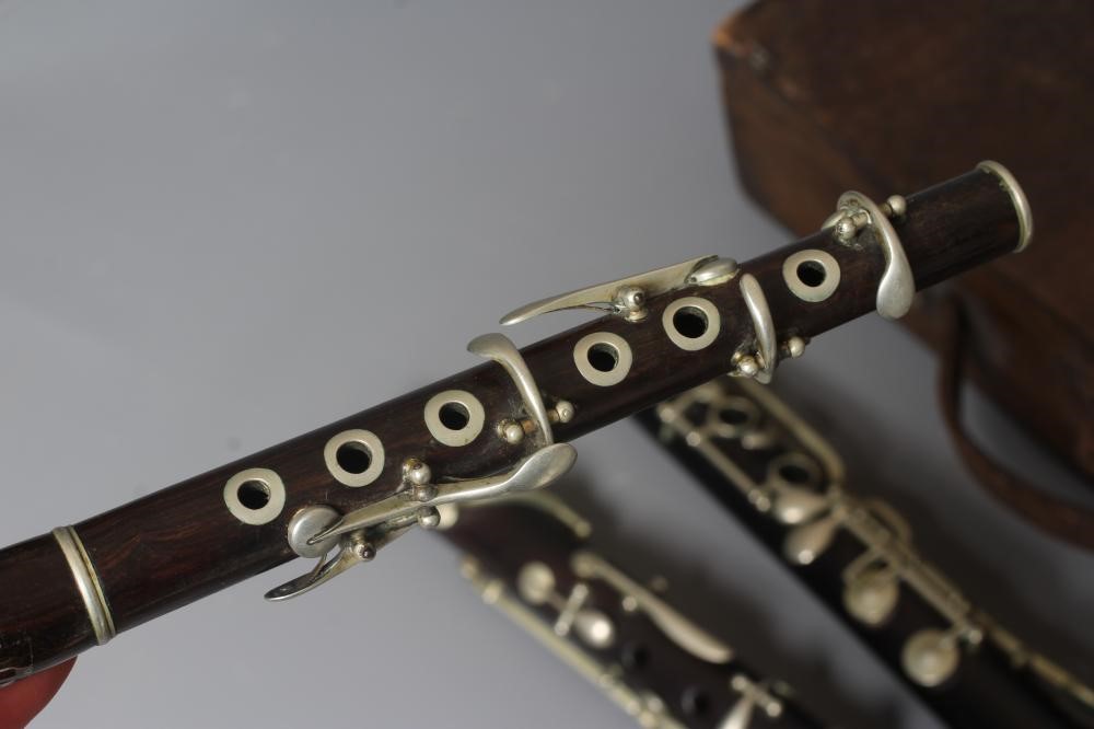 A ROSEWOOD FOUR PIECE CLARINET BY J R LAFLEUR, bell stamped with maker's name, 25 1/2" long, Image