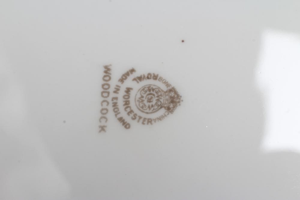 JAMES STINTON - THREE ROYAL WORCESTER PORCELAIN CABINET PLATES centrally painted with 'Woodcock' Image