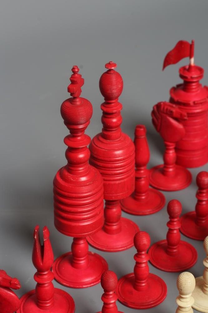 AN ANGLO INDIAN TURNED BONE LARGE CHESS SET, mid 19th century, natural and stained red, Kings 6" Image