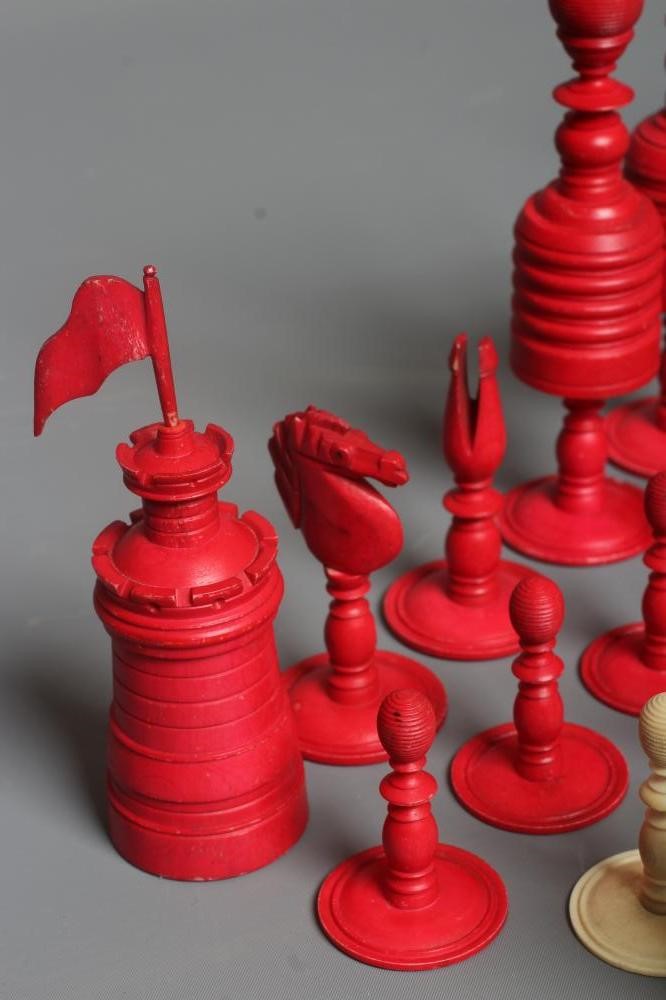 AN ANGLO INDIAN TURNED BONE LARGE CHESS SET, mid 19th century, natural and stained red, Kings 6" Image