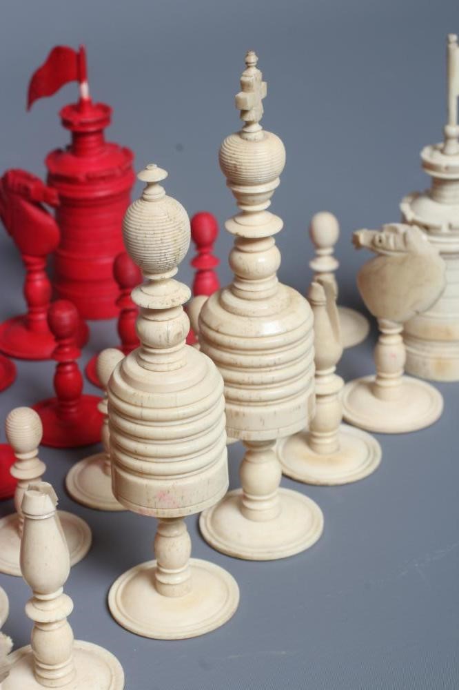 AN ANGLO INDIAN TURNED BONE LARGE CHESS SET, mid 19th century, natural and stained red, Kings 6" Image