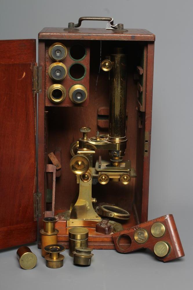 A LATE VICTORIAN BINOCULAR MICROSCOPE BY DOLLAND, LONDON with assorted optics, lenses and Image