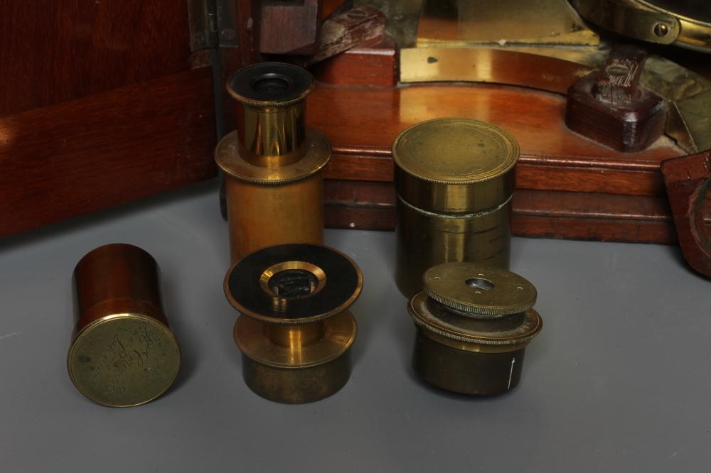 A LATE VICTORIAN BINOCULAR MICROSCOPE BY DOLLAND, LONDON with assorted optics, lenses and Image