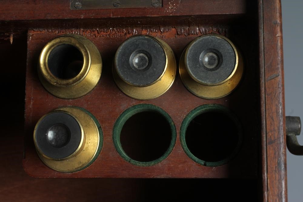 A LATE VICTORIAN BINOCULAR MICROSCOPE BY DOLLAND, LONDON with assorted optics, lenses and Image