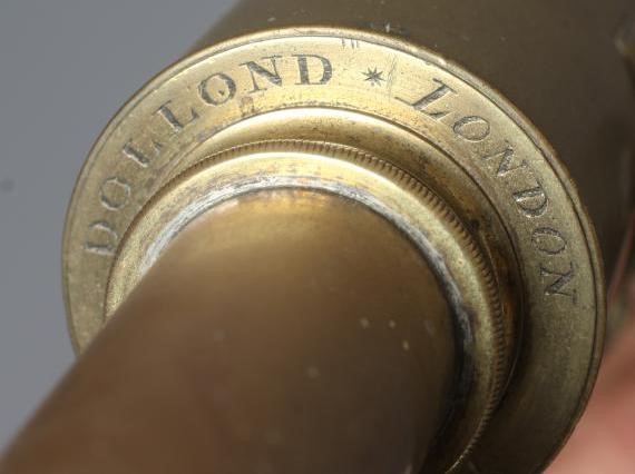 A 19TH CENTURY BRASS TELESCOPE BY DOLLOND, LONDON, two draw action raised on a tripod base, the tube Image