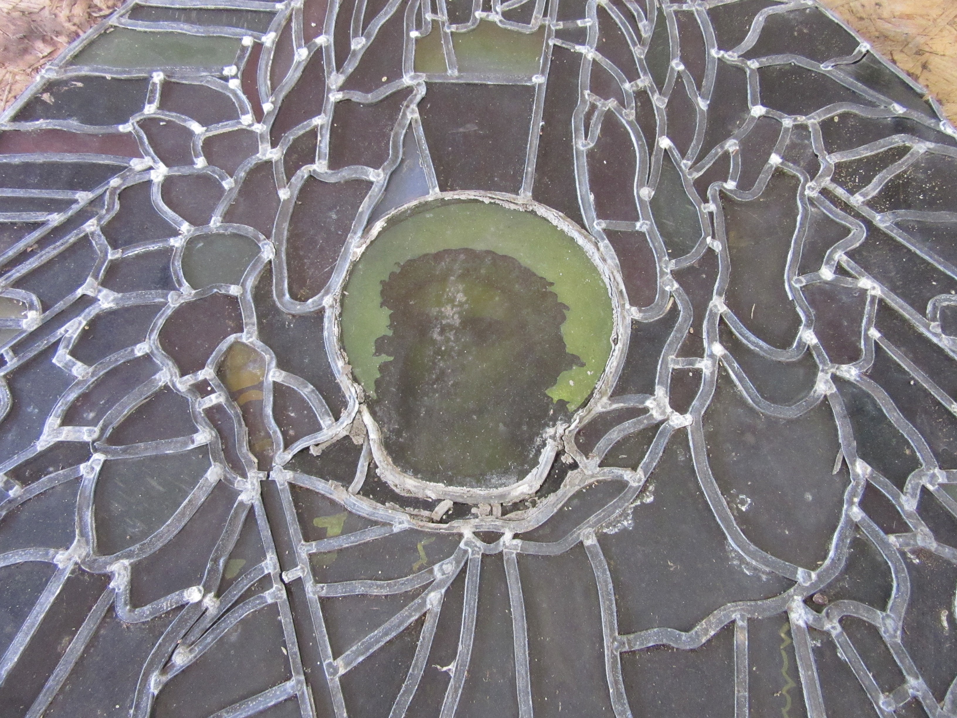 A VICTORIAN PRE-RAPHAELITE STYLE PAINTED AND STAINED LEADED ARCHED GLASS PANEL depicting Jesus on Image