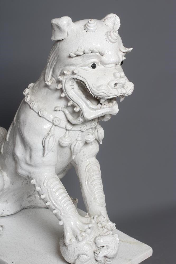 A LARGE PAIR OF WHITE CRACKLE GLAZED TERRACOTTA TEMPLE LIONS Image