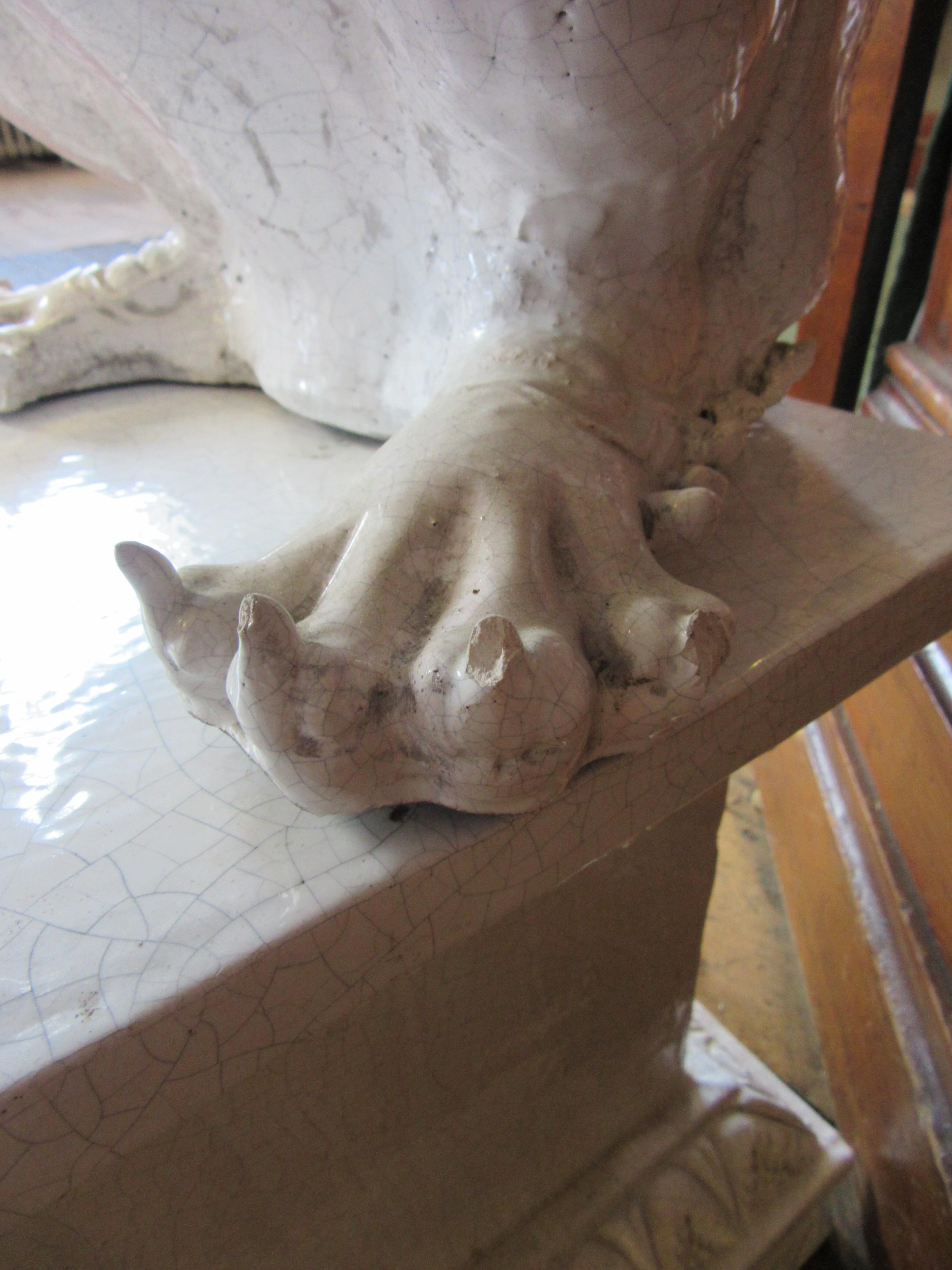 A LARGE PAIR OF WHITE CRACKLE GLAZED TERRACOTTA TEMPLE LIONS Image
