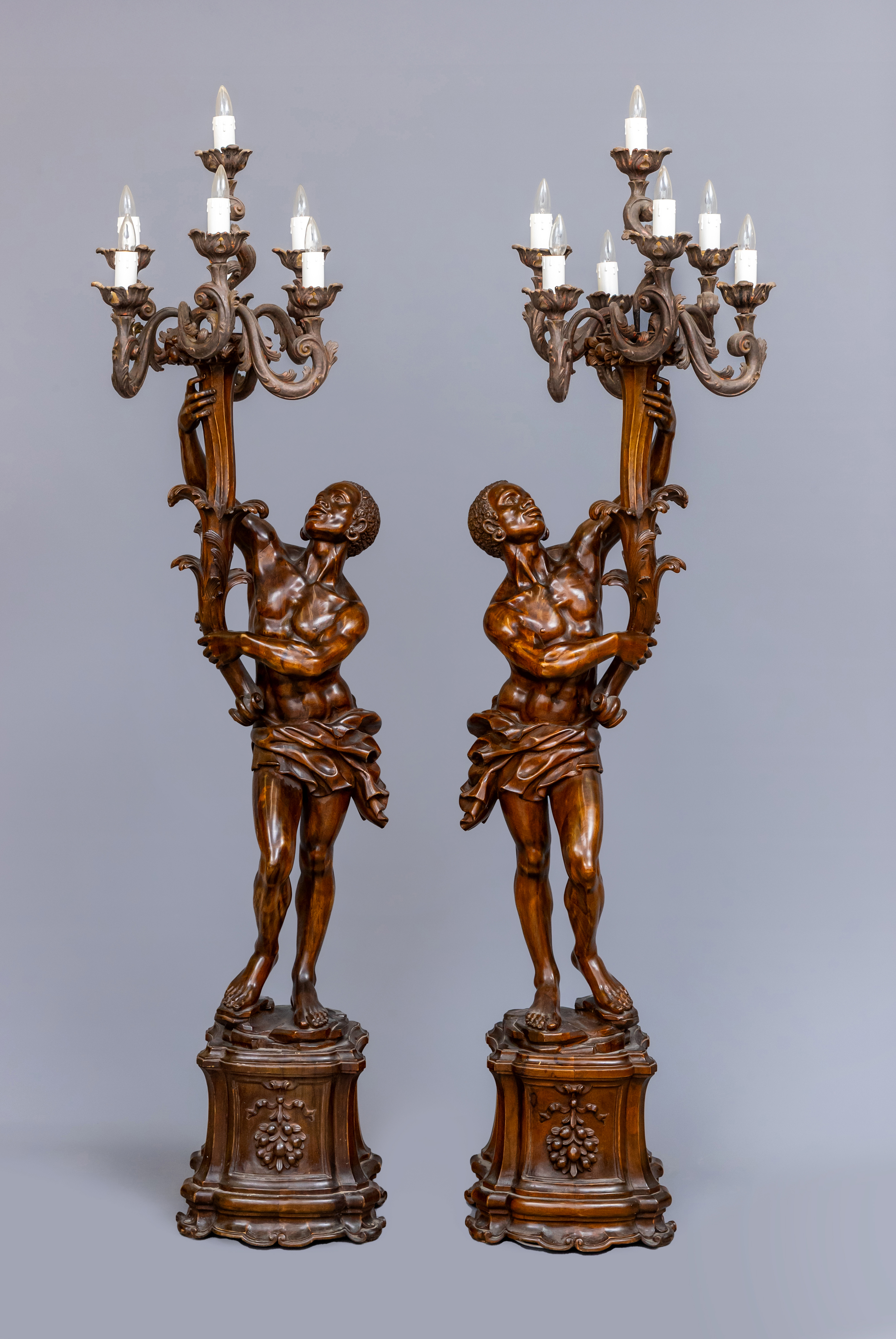A PAIR OF CARVED WOOD CANDELABRA FIGURES OF BLACKAMOORS Image