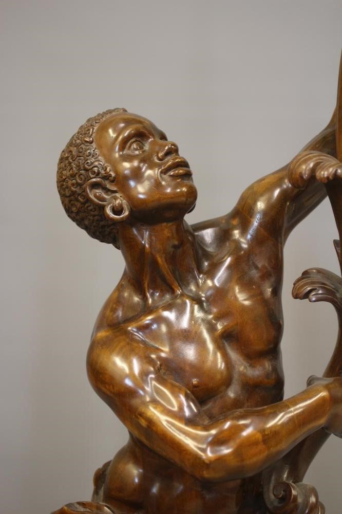 A PAIR OF CARVED WOOD CANDELABRA FIGURES OF BLACKAMOORS Image