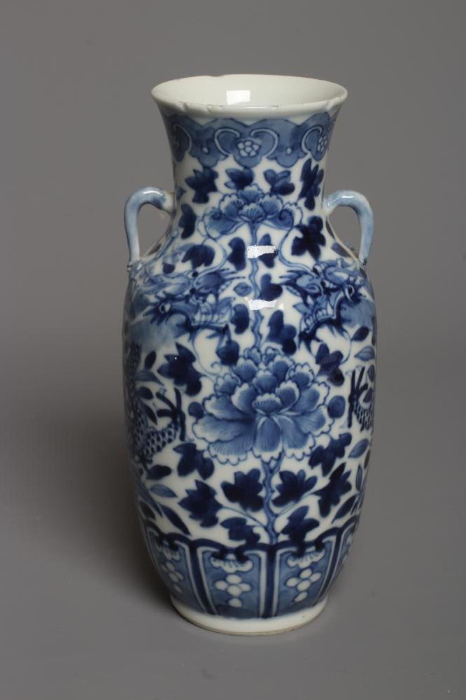 A CHINESE PORCELAIN VASE of rounded cylindrical form with two small loop handles Image