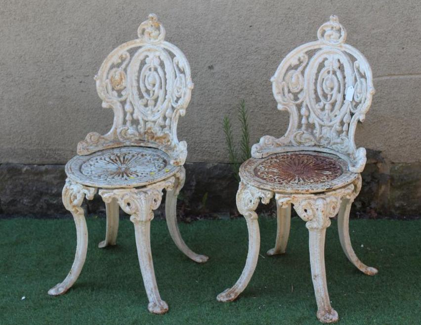 A PAIR OF VICTORIAN CAST IRON CHAIRS in Coalbrookdale design, the waisted medallion back over Image