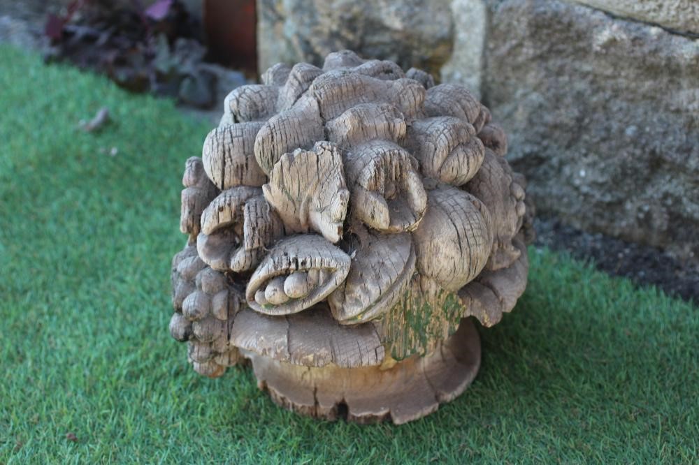 A CARVED SOFTWOOD CYLINDRICAL FINIAL surmounted by a vase of fruit, 25" high (excluding spike), Image