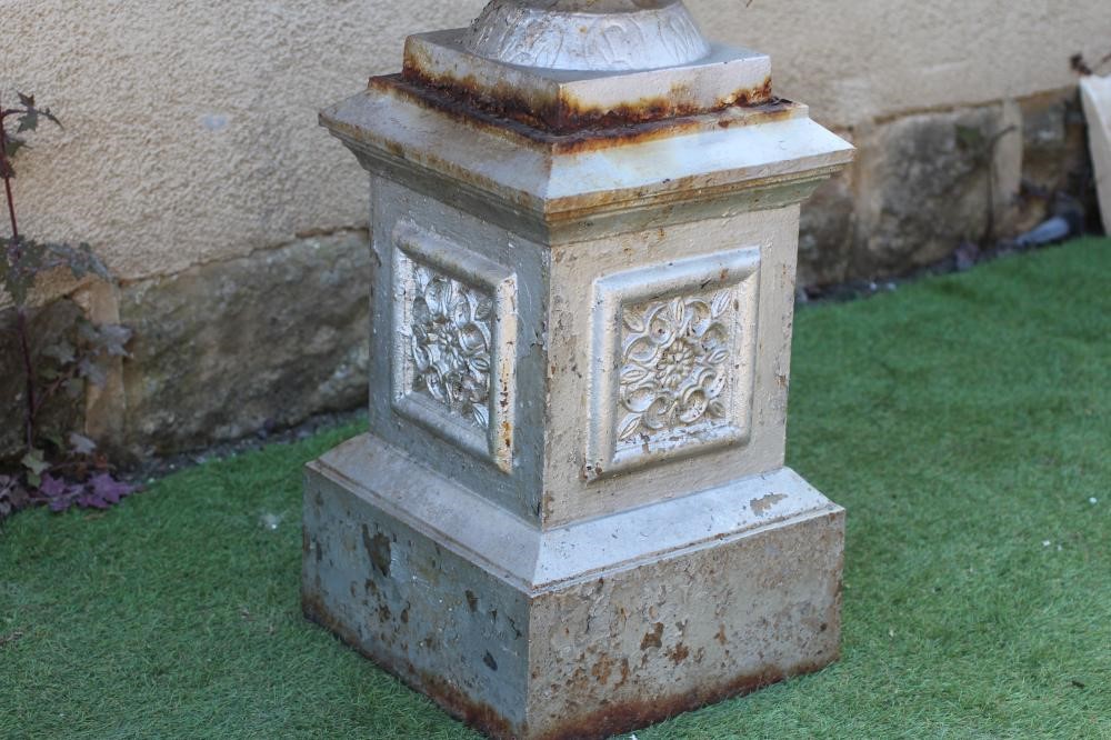 A CAST METAL URN ON STAND Image