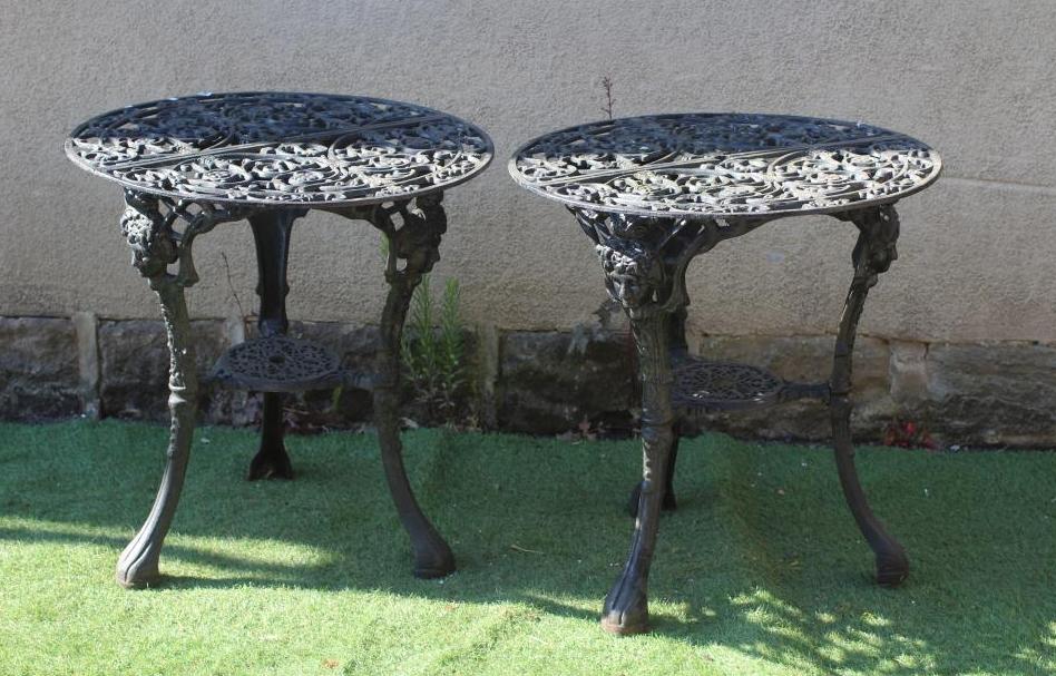 A PAIR OF CAST IRON PUB TABLES Image