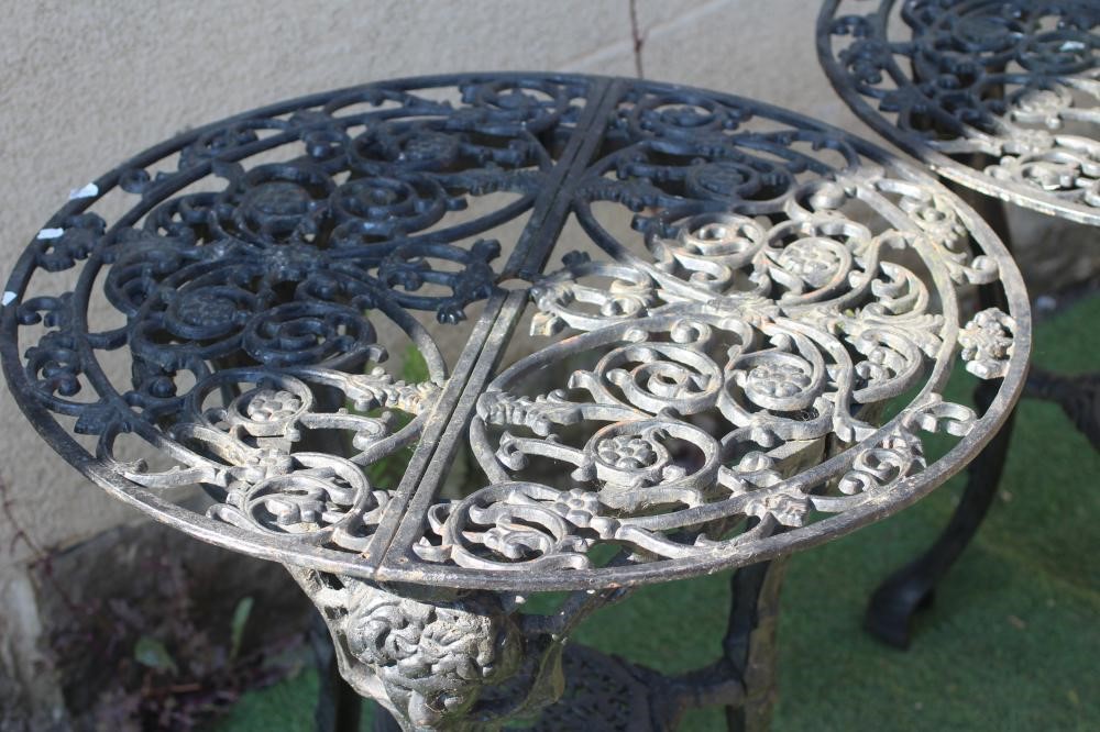 A PAIR OF CAST IRON PUB TABLES Image