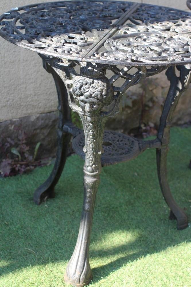 A PAIR OF CAST IRON PUB TABLES Image