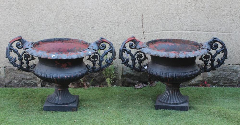 A PAIR OF CAST IRON URNS, 20th century, of semi fluted campana form with scrolled handles and ovolo Image