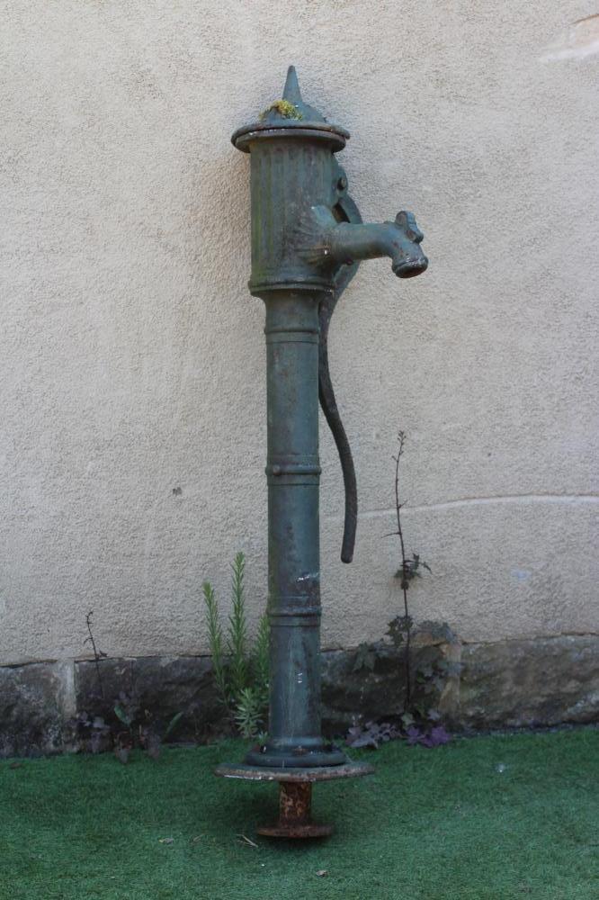 A VICTORIAN CAST IRON WATER PUMP with spike finial, on reeded dome lid and collared cylindrical Image
