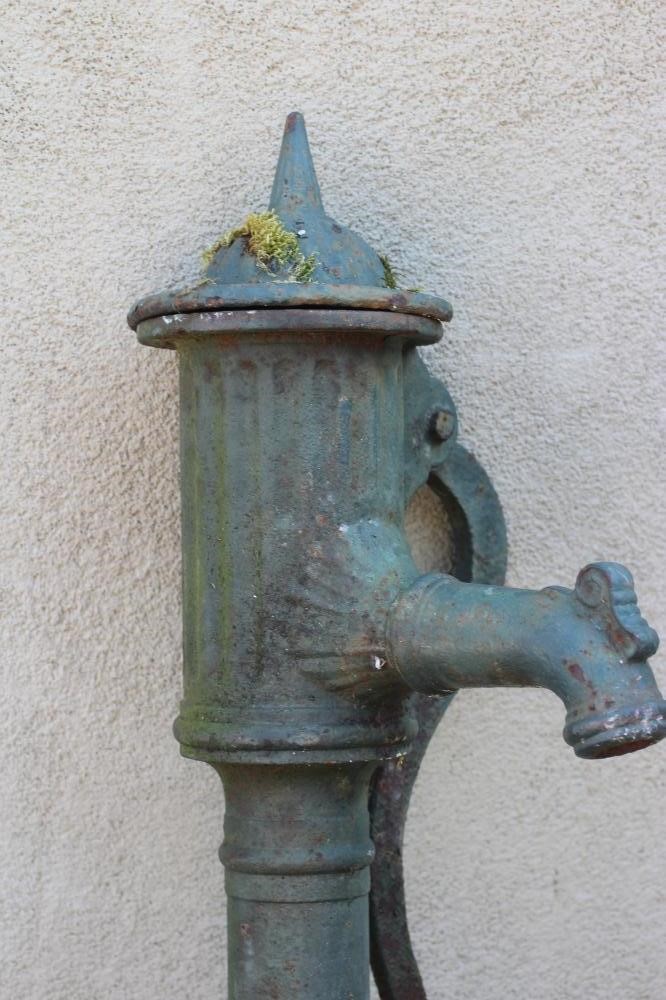 A VICTORIAN CAST IRON WATER PUMP with spike finial, on reeded dome lid and collared cylindrical Image