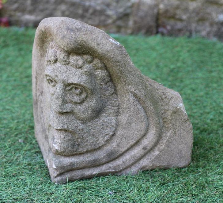 A CARVED SANDSTONE CORBEL modelled as a medieval style bearded male head, 10" w x 9" d x 9 1/2" h Image