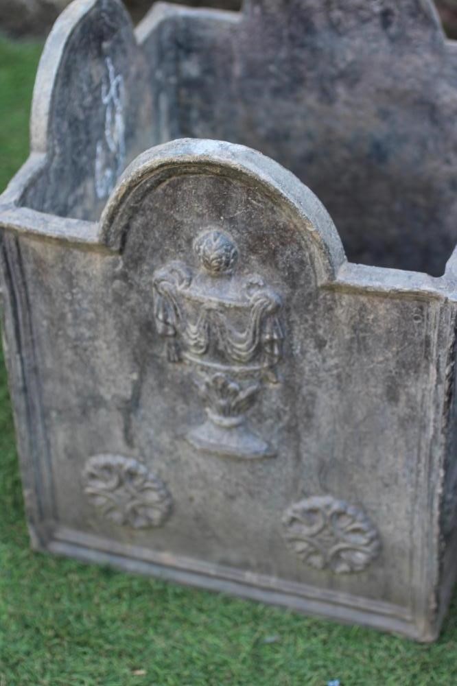 A PAIR OF WEATHERED LEAD SQUARE PLANTERS, the arched moulded sides cast in relief with draped Image