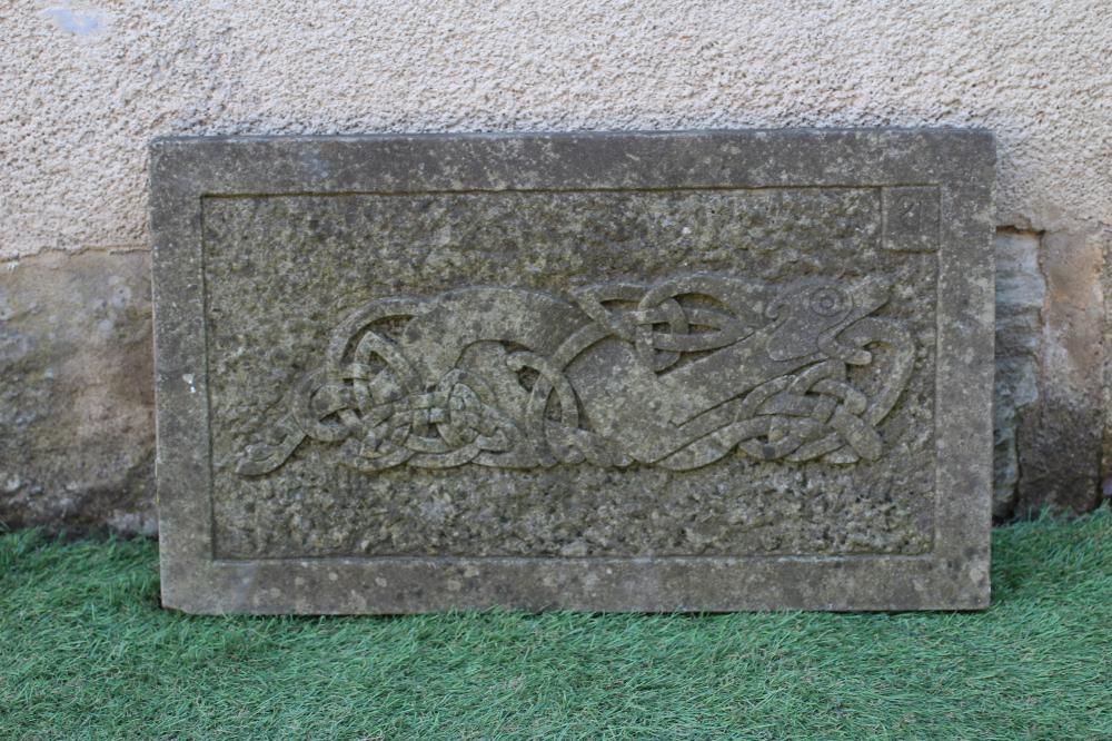 A CARVED SANDSTONE CELTIC STYLE OBLONG WALL PLAQUE depicting an elaborate knot incorporating a Image