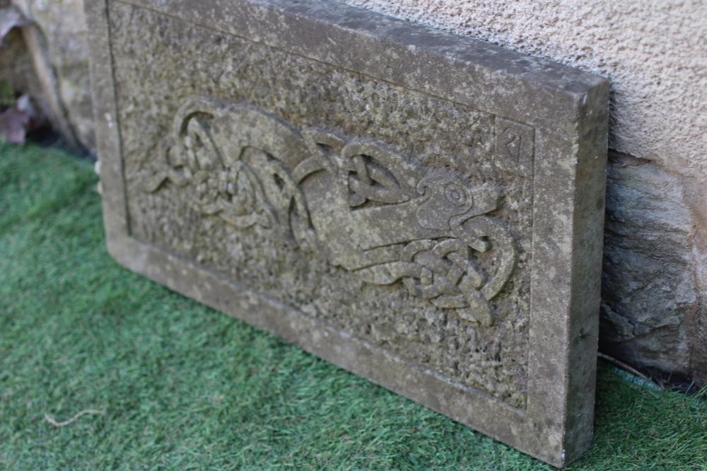 A CARVED SANDSTONE CELTIC STYLE OBLONG WALL PLAQUE depicting an elaborate knot incorporating a Image