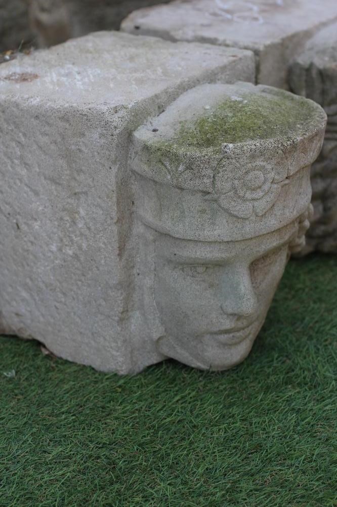 A PAIR OF CAST STONE FIGURAL CORBELS, modelled as King and Queen heads, 8 1/4" w x 12" d x 9 1/2" h Image