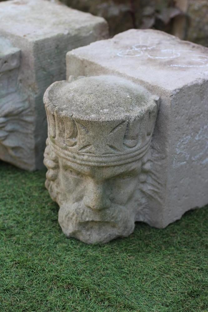 A PAIR OF CAST STONE FIGURAL CORBELS, modelled as King and Queen heads, 8 1/4" w x 12" d x 9 1/2" h Image