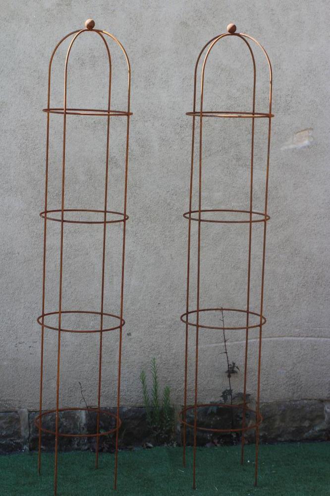 A PAIR OF WROUGHT IRON CYLINDRICAL PLANT OBELISKS, the domed top with ball finial, 15" w x 81" h Image