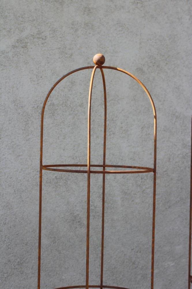 A PAIR OF WROUGHT IRON CYLINDRICAL PLANT OBELISKS, the domed top with ball finial, 15" w x 81" h Image