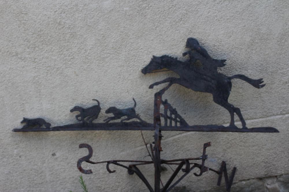 AN IRON WEATHERVANE, 20th century, the surmount depicting a fox hunting scene, 46" w x 46" h, with Image
