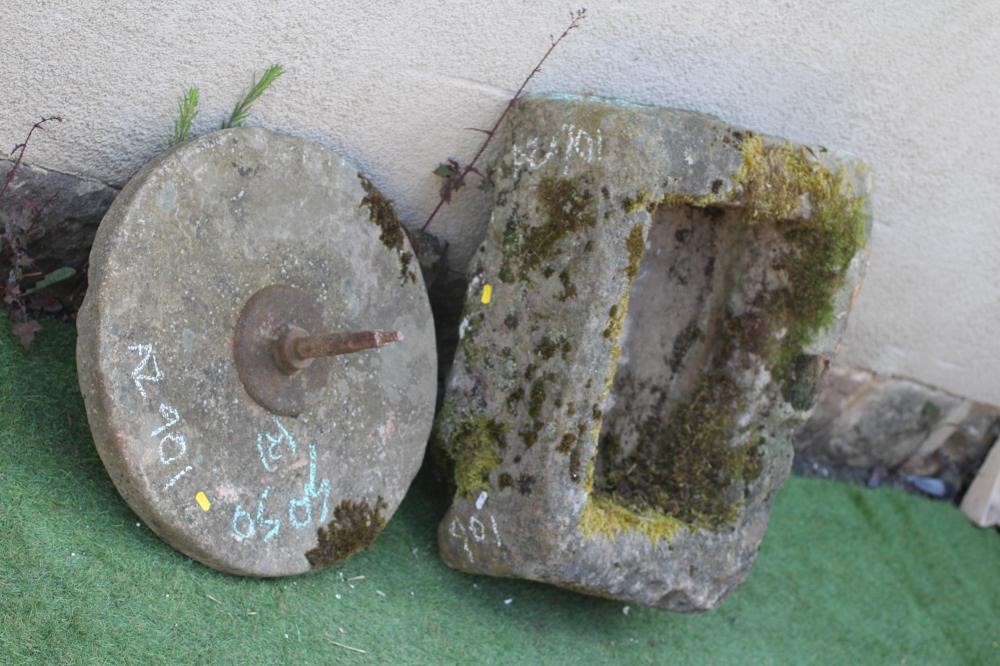 A SANDSTONE TROUGH of rough-hewn oblong form, 26" w x 20" d x 8" h, together with a grinding wheel, Image