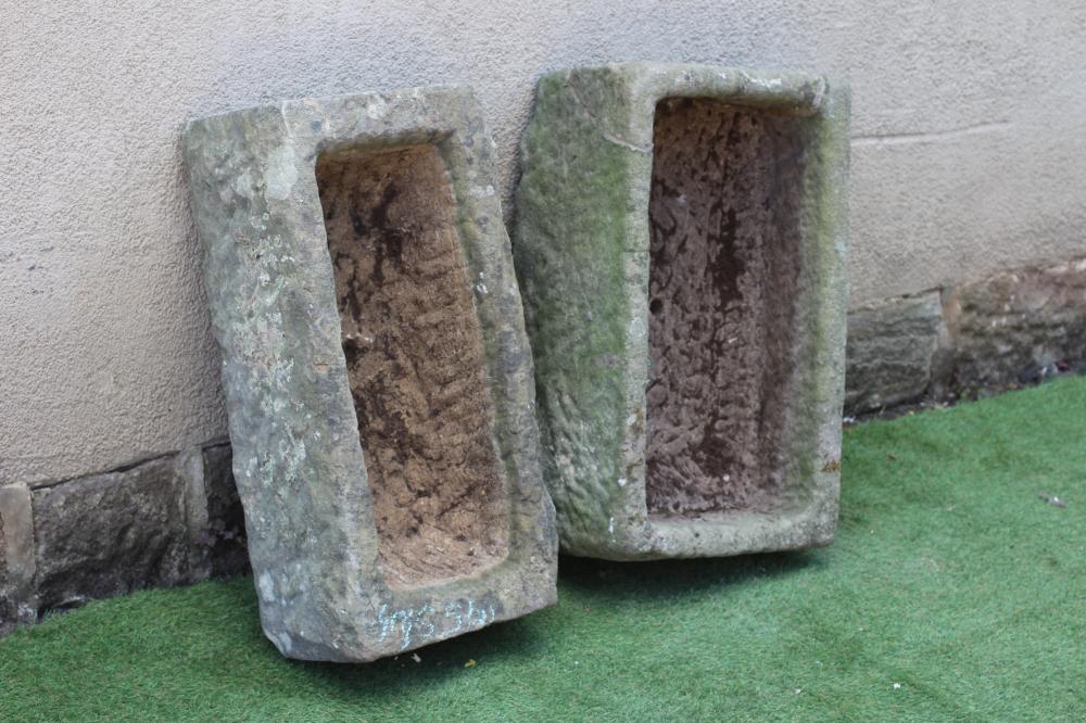 TWO SANDSTONE TROUGHS of rough-hewn oblong form, 29 1/2" w x 14 1/2" d x 9" h, and 29" w x 17 1/2" d Image
