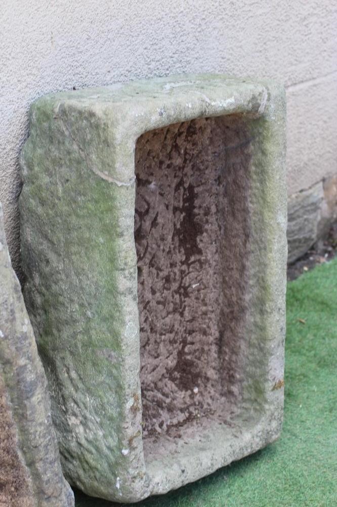 TWO SANDSTONE TROUGHS of rough-hewn oblong form, 29 1/2" w x 14 1/2" d x 9" h, and 29" w x 17 1/2" d Image