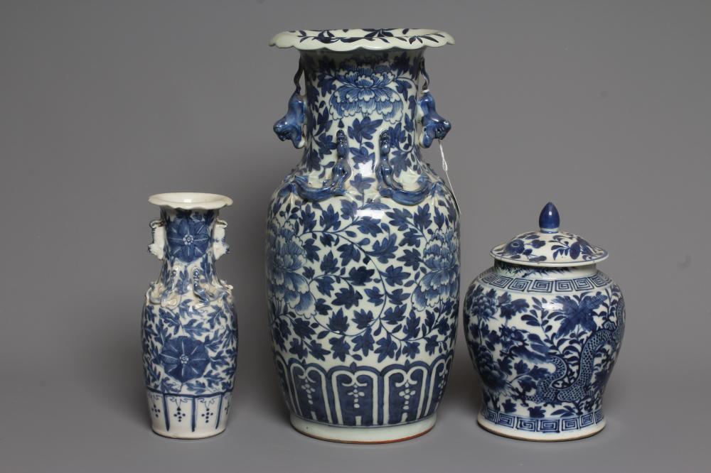 A CHINESE PORCELAIN JAR AND COVER of inverted baluster form painted in underglaze blue with two four Image