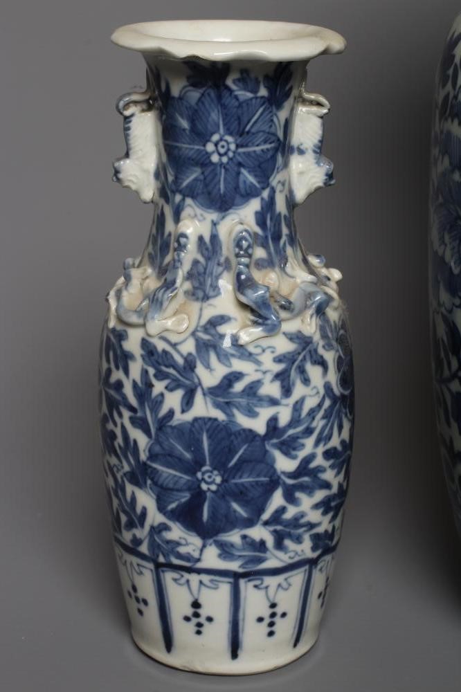 A CHINESE PORCELAIN JAR AND COVER of inverted baluster form painted in underglaze blue with two four Image