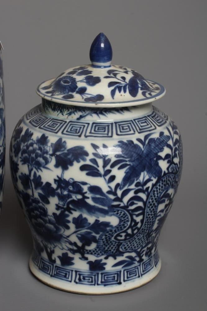 A CHINESE PORCELAIN JAR AND COVER of inverted baluster form painted in underglaze blue with two four Image