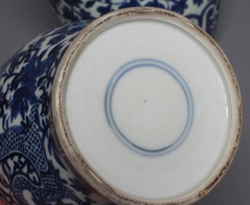 A CHINESE PORCELAIN JAR AND COVER of inverted baluster form painted in underglaze blue with two four Image