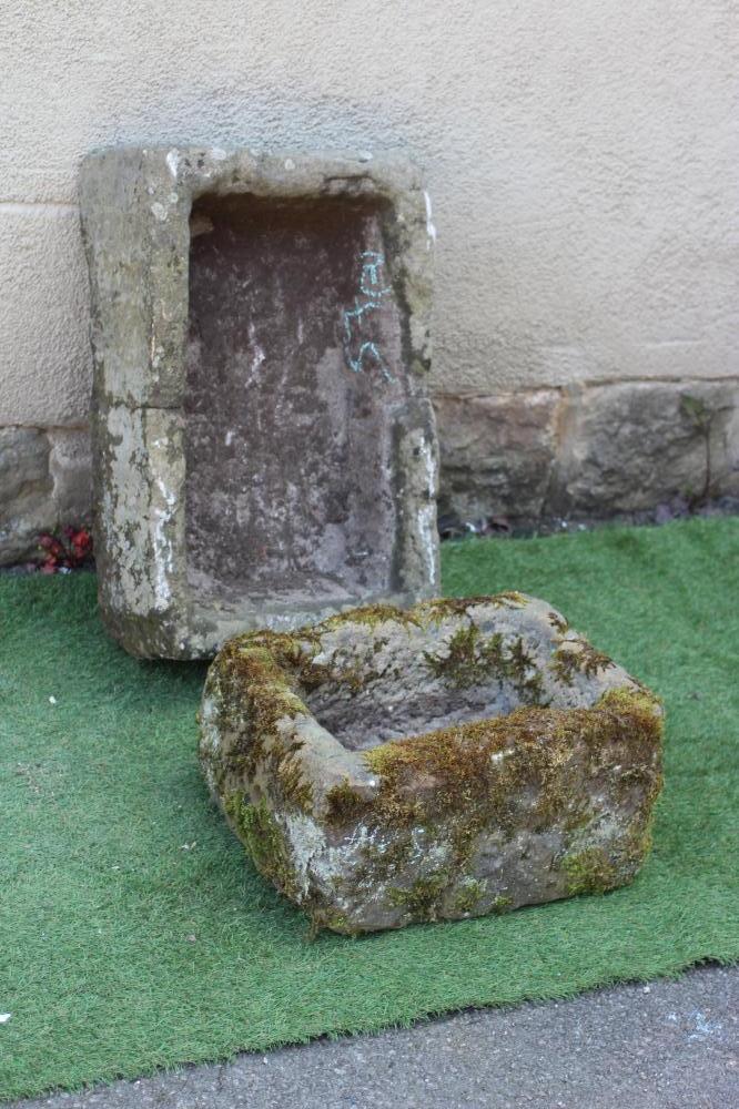 A SANDSTONE TROUGH of rough-hewn oblong form, 26" w x 16" d x 8 1/2" h, together with a similar Image
