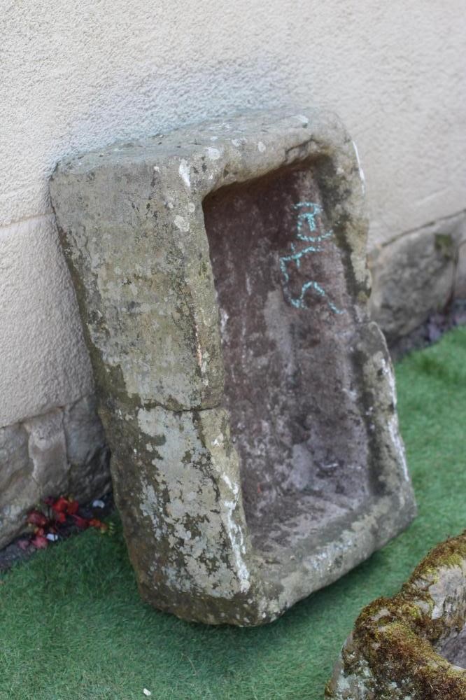 A SANDSTONE TROUGH of rough-hewn oblong form, 26" w x 16" d x 8 1/2" h, together with a similar Image