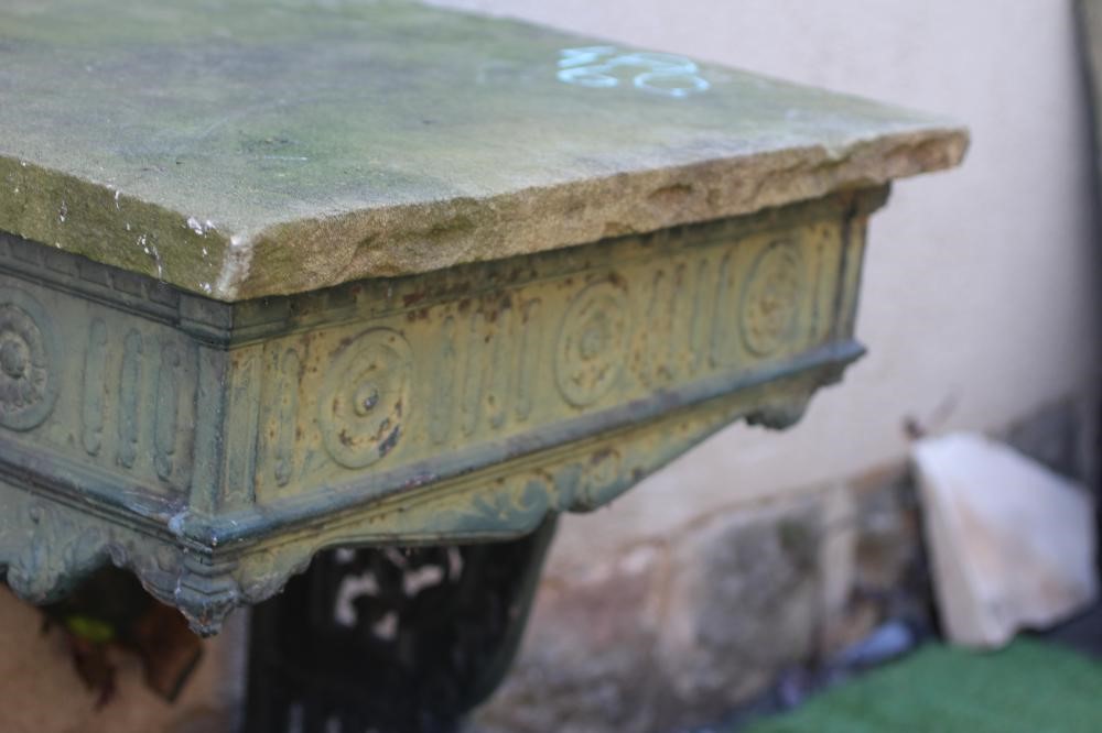 A VICTORIAN CAST IRON STAND, the fluted frieze with rosettes, raised on pierced scrolling foliate Image